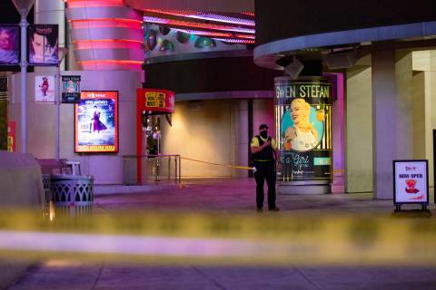 A security guard at the scene on the Strip where a man was shot at the Miracle Miles shops in L ...