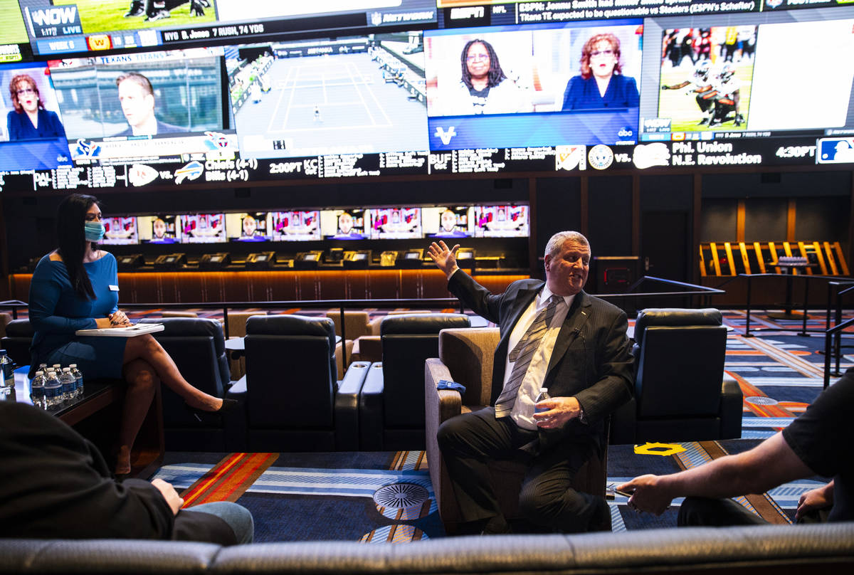 Casino owner Derek Stevens points to the display at the Circa Sportsbook on Monday, Oct. 19, 20 ...