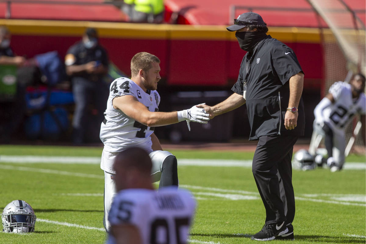 Las Vegas Raiders inside linebacker Nick Kwiatkoski (44) greets defensive coordinator Paul Guen ...