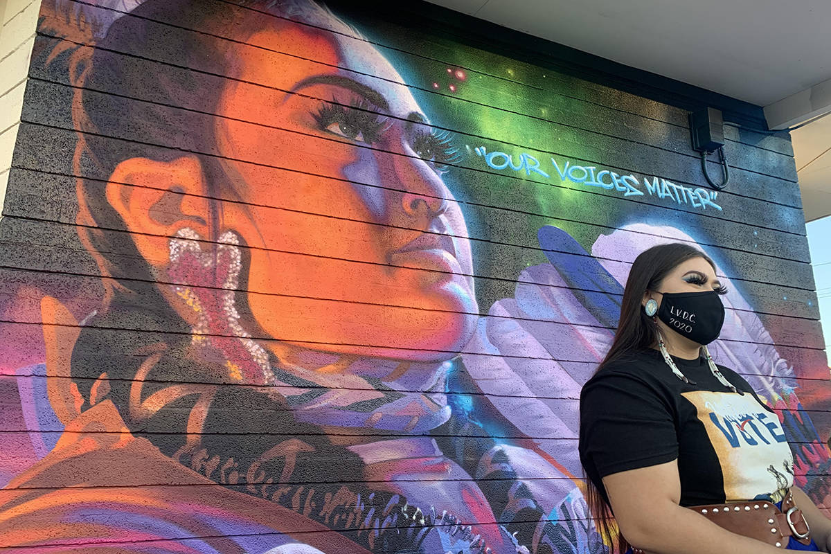 Amaia Marcos, 19, poses in front of the Las Vegas Indian Center's new "Our Voices Matter" mural ...