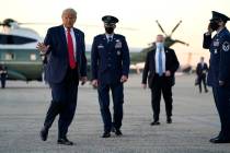 President Donald Trump boards Air Force One for a trip to Johnstown, Pa., to attend a campaign ...