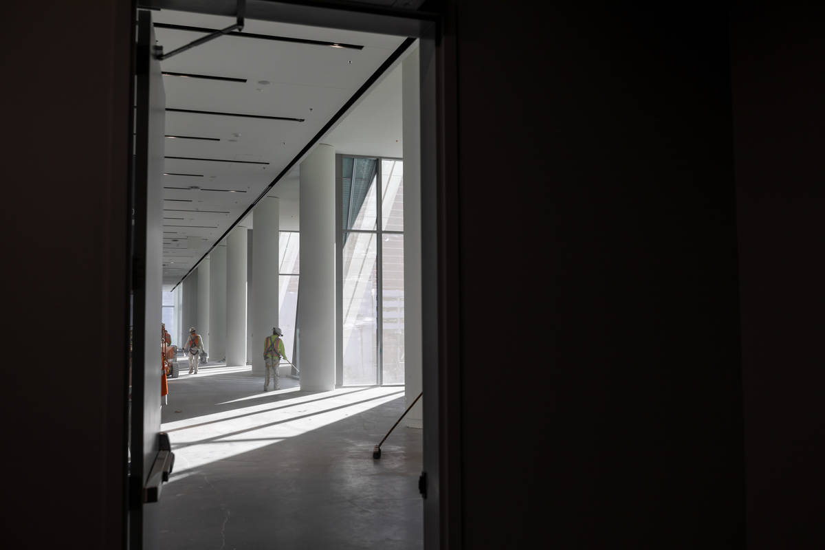 The third floor overlooking the main entrance is swept during a tour of the Las Vegas Conventio ...