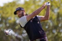 In this Saturday, Sept. 19, 2020, file photo, Dustin Johnson hits from the fourth tee during th ...