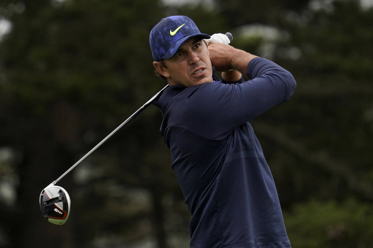 This Aug. 8, 2020, file photo shows Brooks Koepka watching his tee shot on the 14th hole during ...