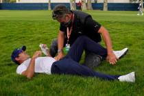 This Aug. 7, 2020, file photo shows Brooks Koepka getting treated for an injury on the 12th hol ...