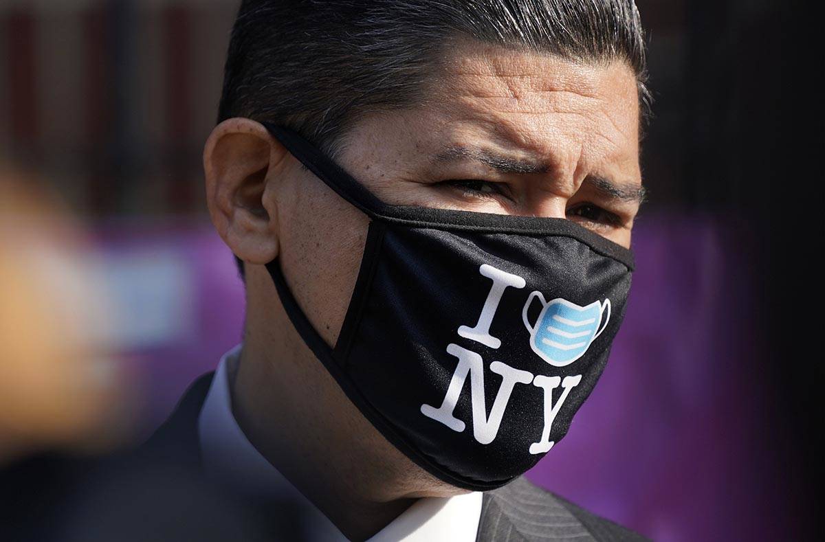 New York City Schools Chancellor Richard Carranza wears a mask during a news conference at the ...