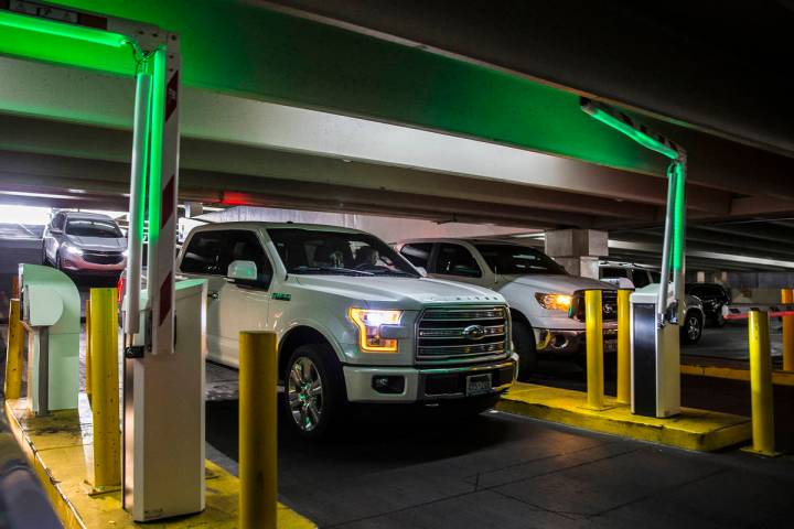 Guests pay for parking at the Caesars Palace garage on Thursday, May 16, 2019, in Las Vegas. (L ...