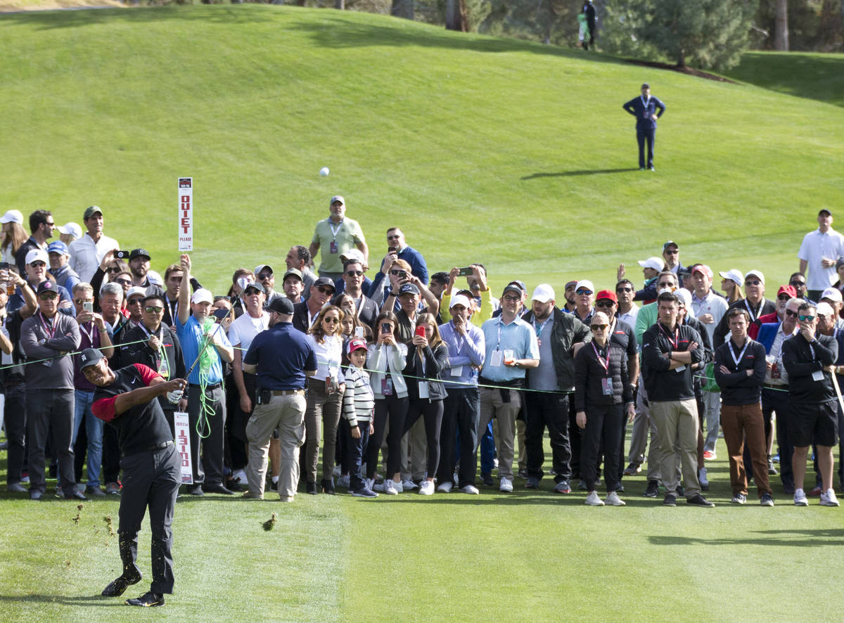 In this Nov. 23, 2018, file photo, Tiger Woods hits from the first fairway during The Match at ...