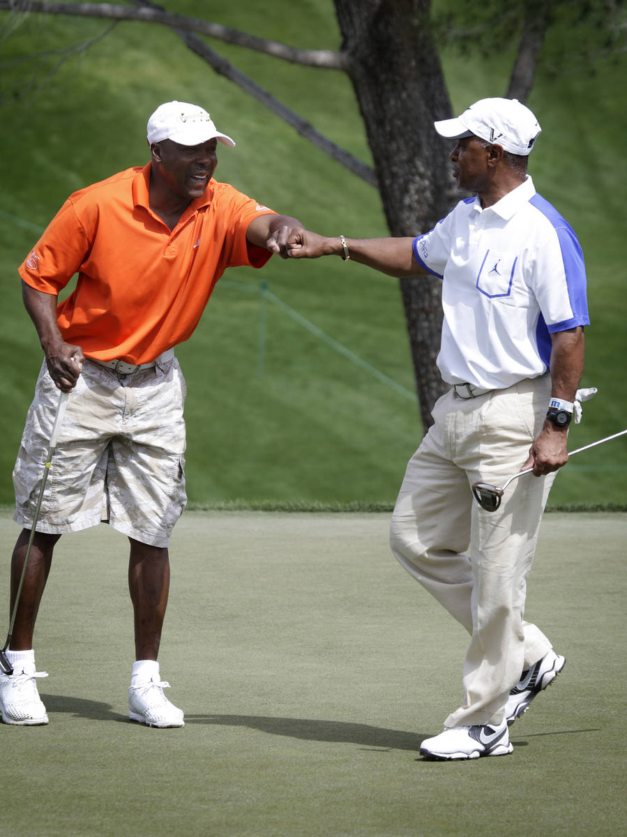 In this April 7, 2013, file photo, Vince Coleman, left, fist-bumps Ozzie Smith after Smith made ...