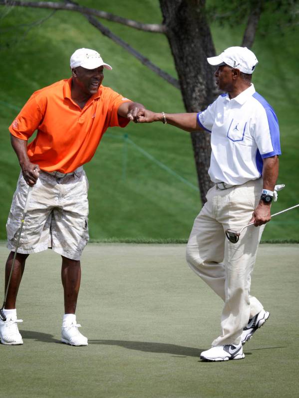 In this April 7, 2013, file photo, Vince Coleman, left, fist-bumps Ozzie Smith after Smith made ...