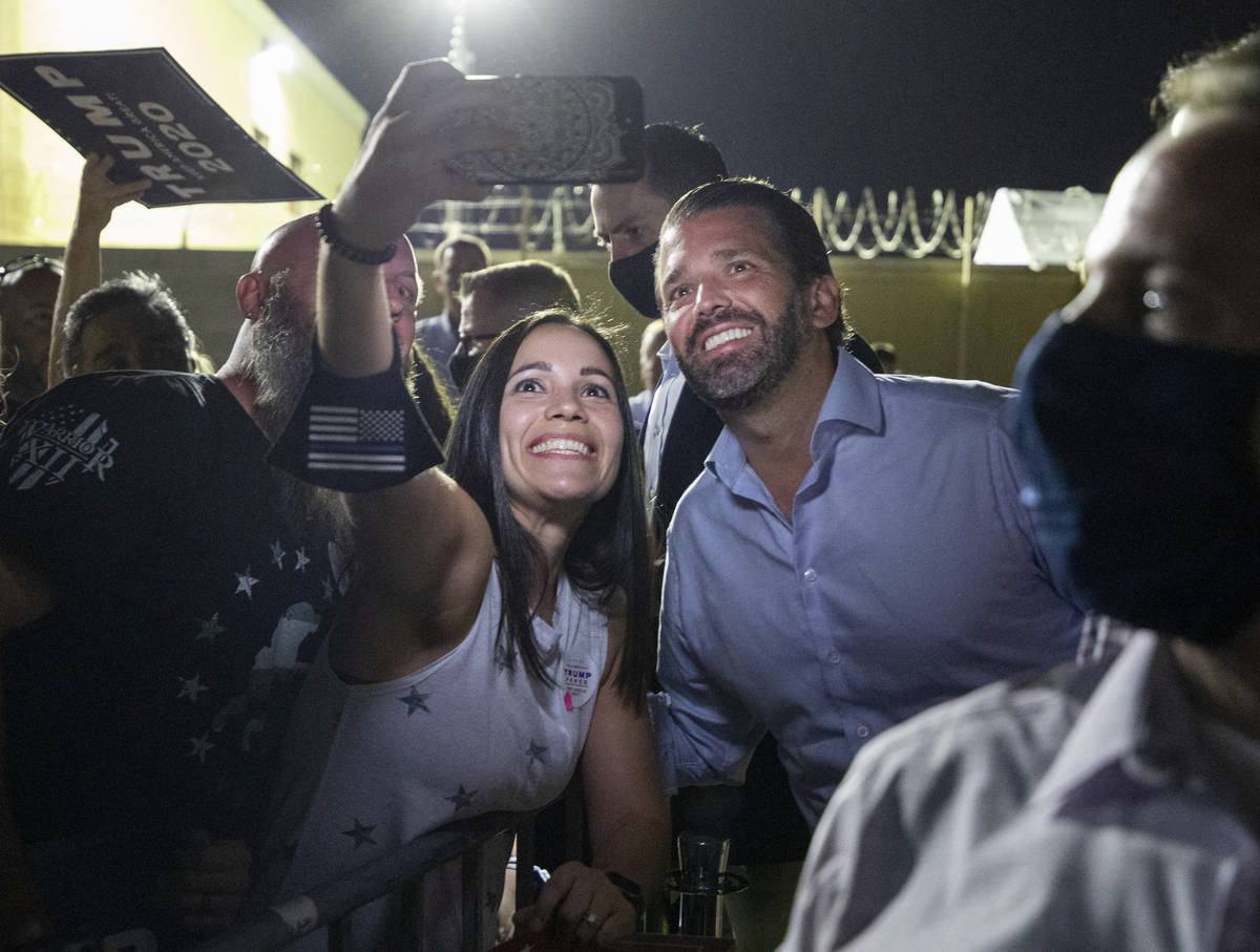 Claire McGartland, of Las Vegas, left, takes a photograph with Donald Trump Jr. after he spoke ...