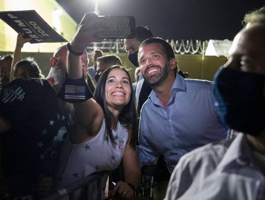 Claire McGartland, of Las Vegas, left, takes a photograph with Donald Trump Jr. after he spoke ...