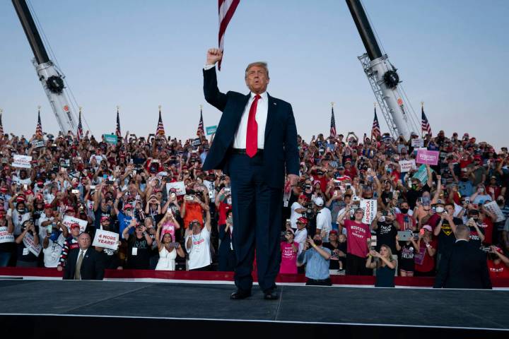 President Donald Trump arrives for a campaign rally at Orlando Sanford International Airport, M ...