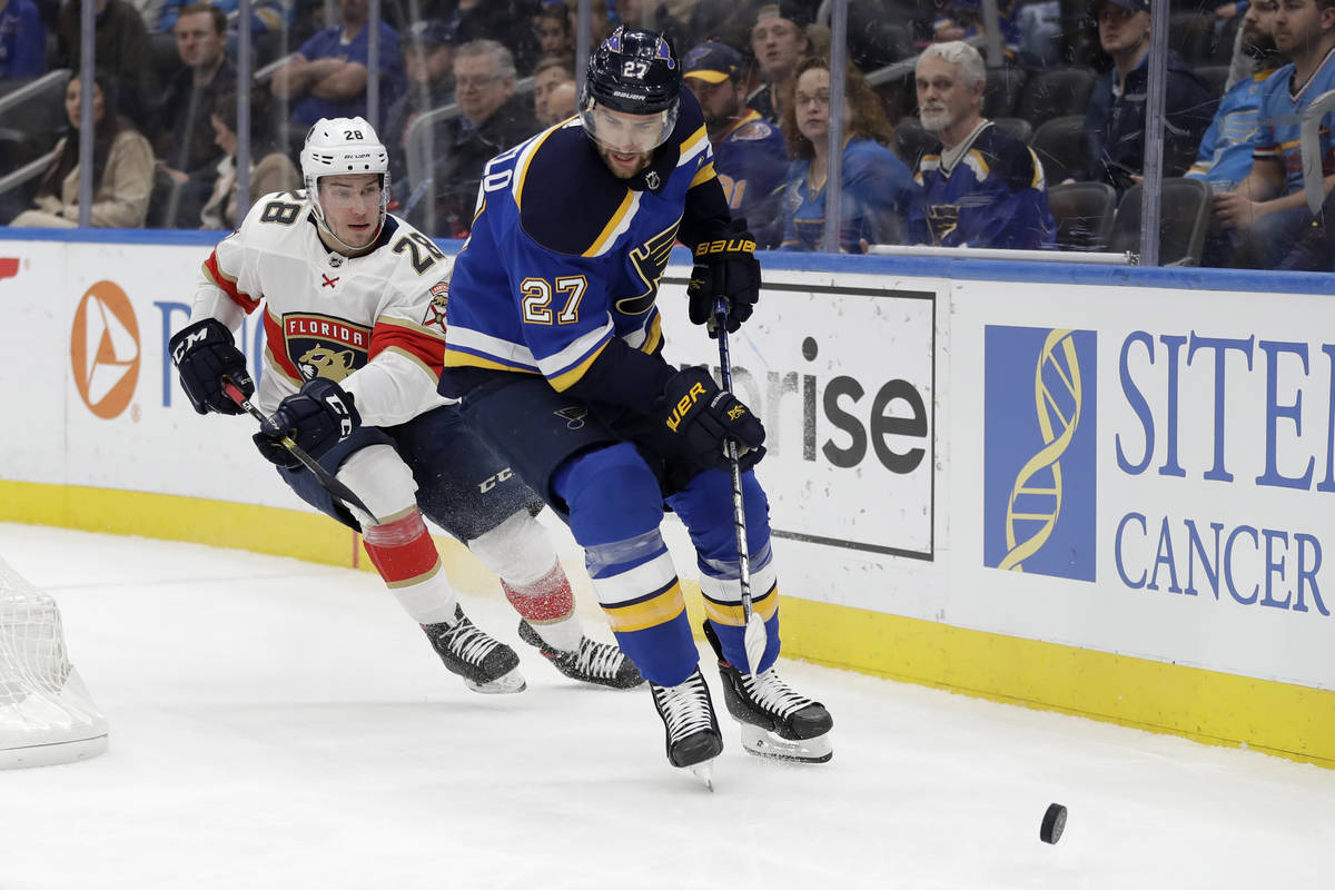FILE - In this March 9, 2020, file photo, St. Louis Blues' Alex Pietrangelo (27) and Florida Pa ...