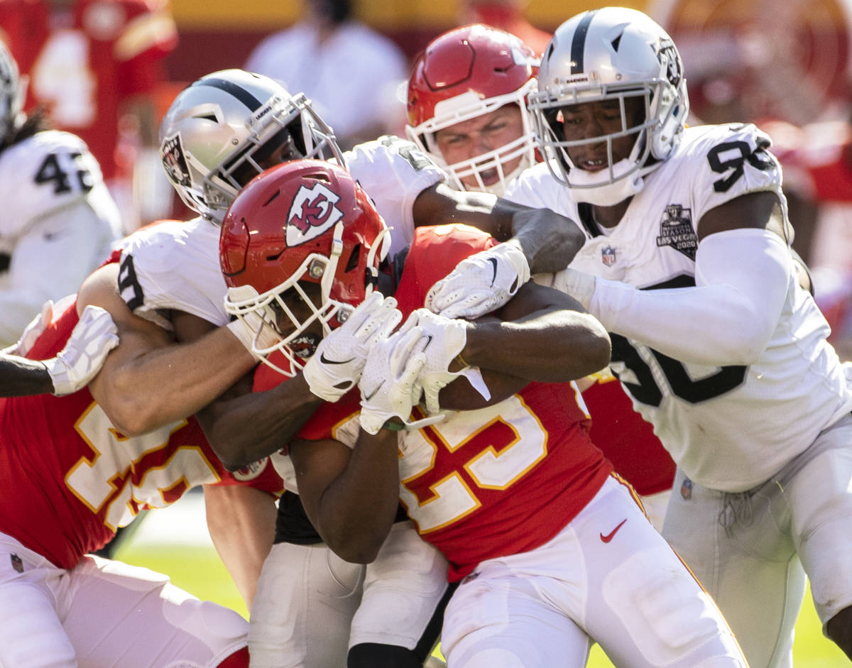 Kansas City Chiefs running back Clyde Edwards-Helaire (25) is stopped at the line of scrimmage ...