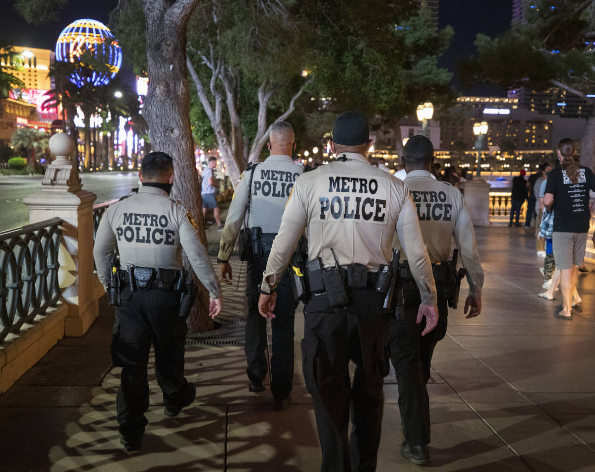 Las Vegas Metro Police are seen patrolling near the Bellagio hotel and casino fountains on the ...