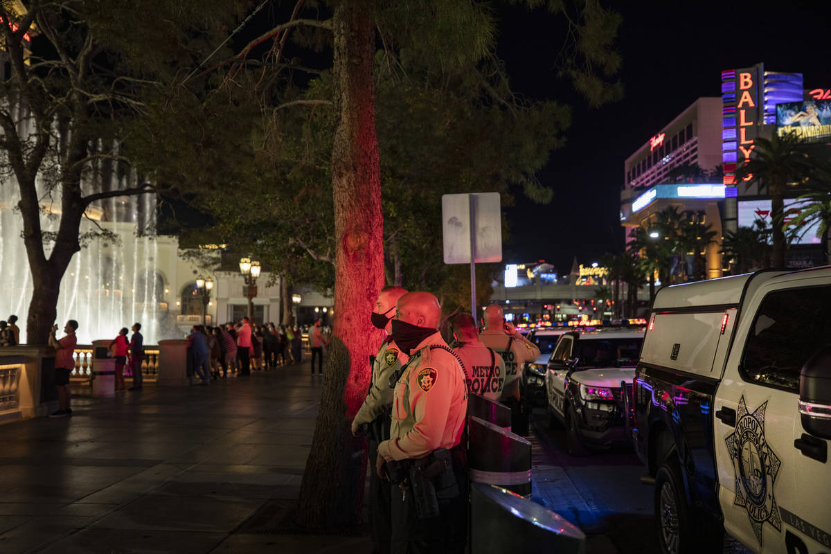 Las Vegas Metro Police are seen patrolling near the Bellagio hotel and casino fountains on the ...