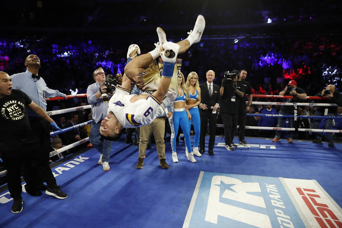 Teofimo Lopez flips in the ring after defeating Ghana's Richard Commey by TKO during the second ...