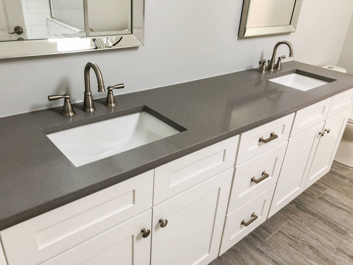 Double sinks and shaker cabinets are popular trends in bathroom remodels. (Getty Images)