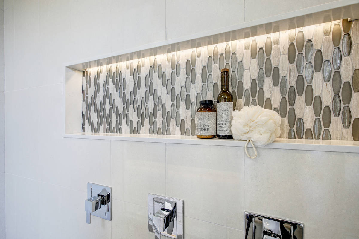A long shower niche fitted with mosaic gray tiles is functional and beautiful. (Getty Images)