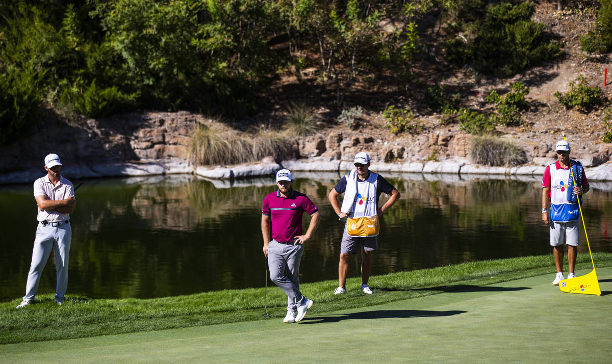 Golfers Matthew Wolff, left, and Tyrrell Hatton, second from left, watch as Jon Rahm, not pictu ...