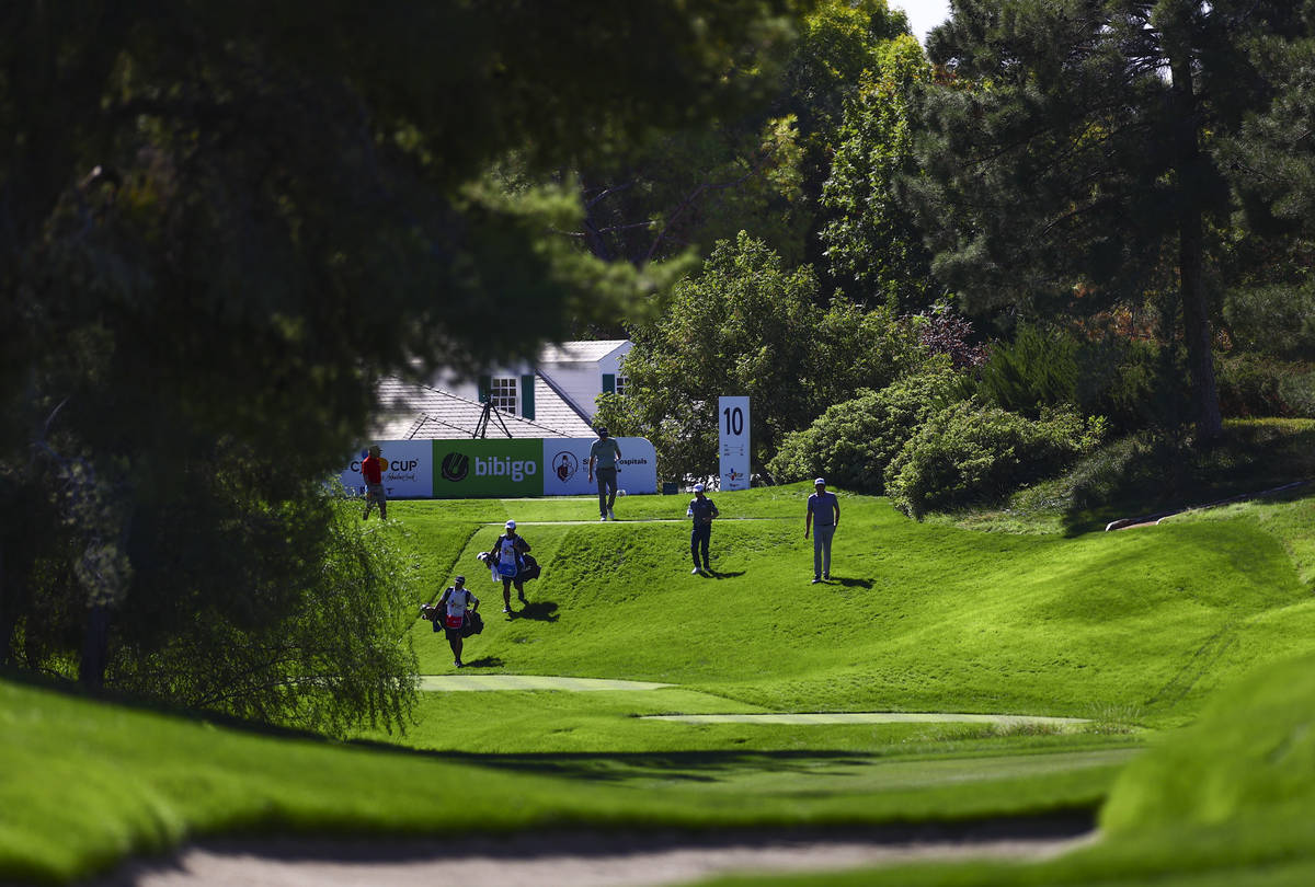 Golfers walk on the fairway of the 10th hole during the first round of the CJ Cup at the Shadow ...