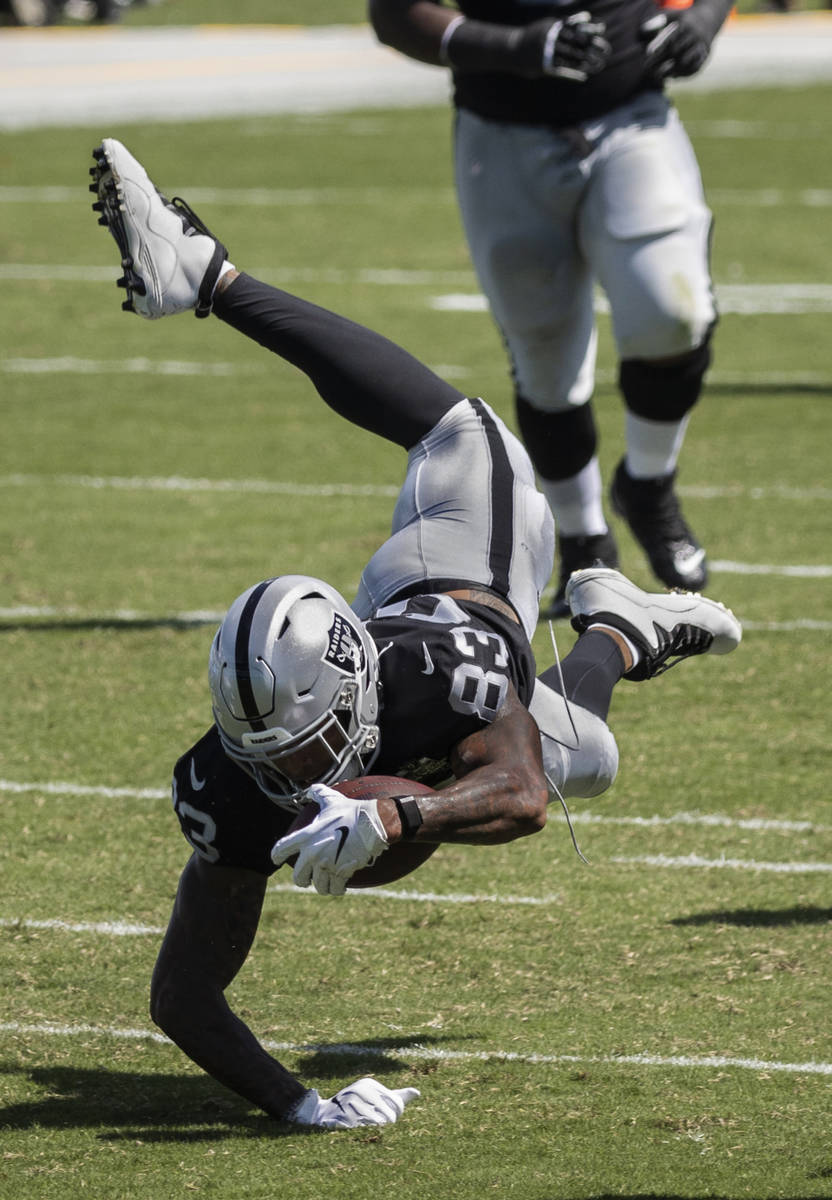 Las Vegas Raiders tight end Darren Waller (83) dives for extra yardage in the second quarter of ...