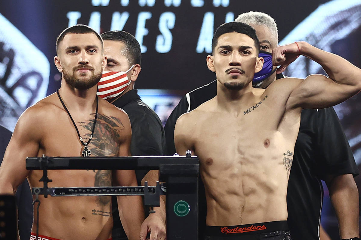 Vasiliy Lomachenko, left, and Teofimo Lopez, right, are shown at the weigh-in Friday, Oct. 16, ...