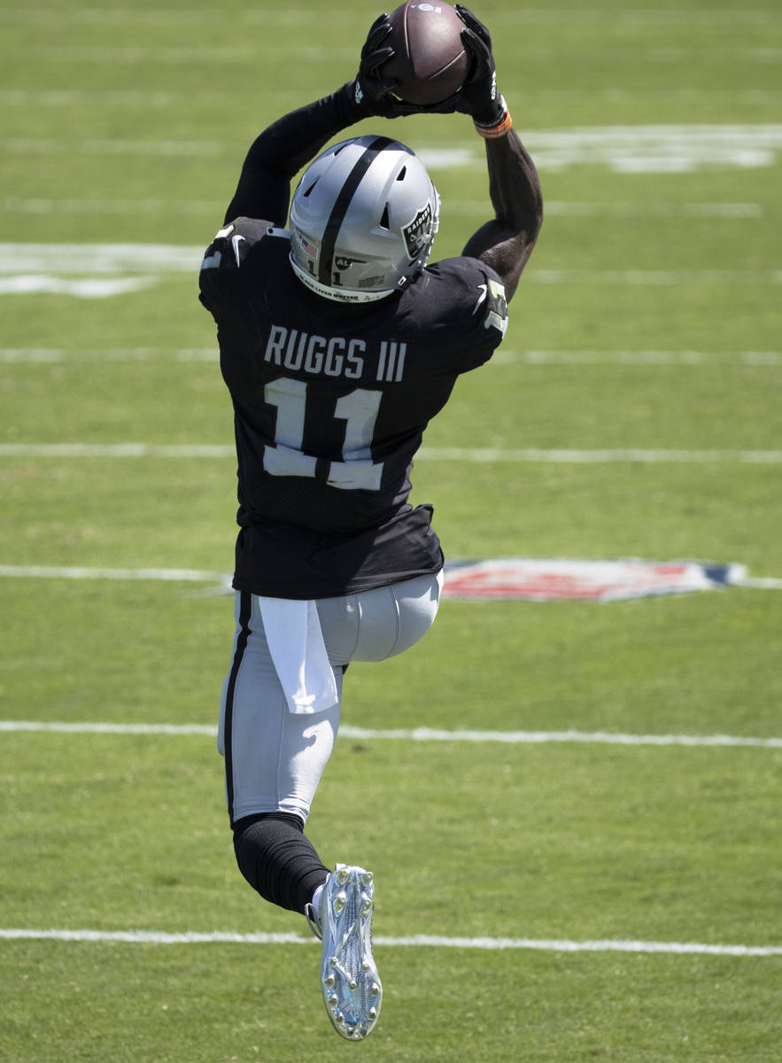 Las Vegas Raiders wide receiver Henry Ruggs III (11) leaps to try and bring down a catch in the ...