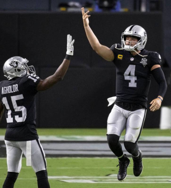 Las Vegas Raiders quarterback Derek Carr (4) celebrates with Las Vegas Raiders wide receiver Ne ...