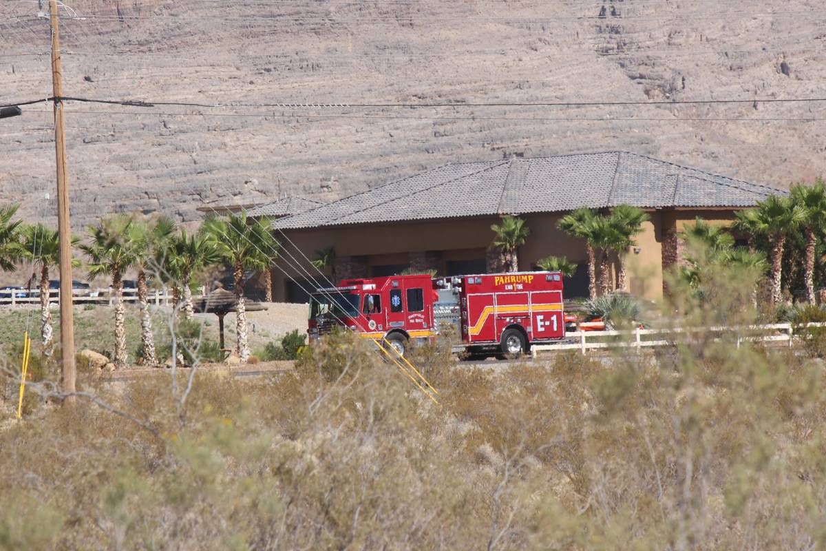A fire truck responds after a helicopter landed in a lake and sank in Pahrump on Friday, Oct. 1 ...
