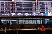 In this June 27, 2019 photo, a gambler places a bet at the new sportsbook at Bally's casino in ...