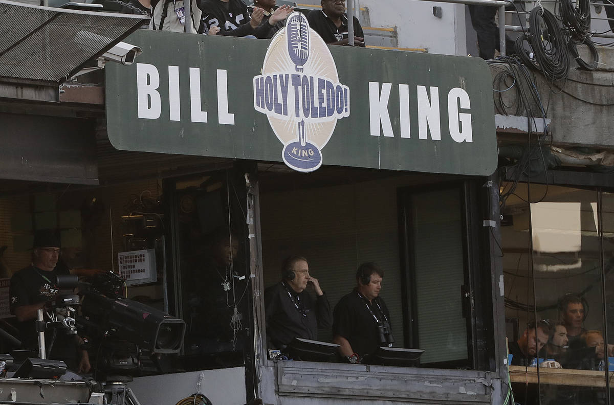 Broadcaster Brent Musburger, center, stands in a radio booth before an NFL preseason football g ...