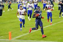 Tennessee Titans running back Derrick Henry (22) scores a touchdown on a 9-yard run against the ...