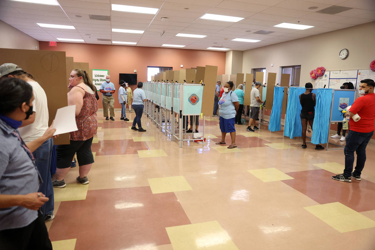People cast their votes inside of the East Las Vegas Community Center polling location in Las V ...