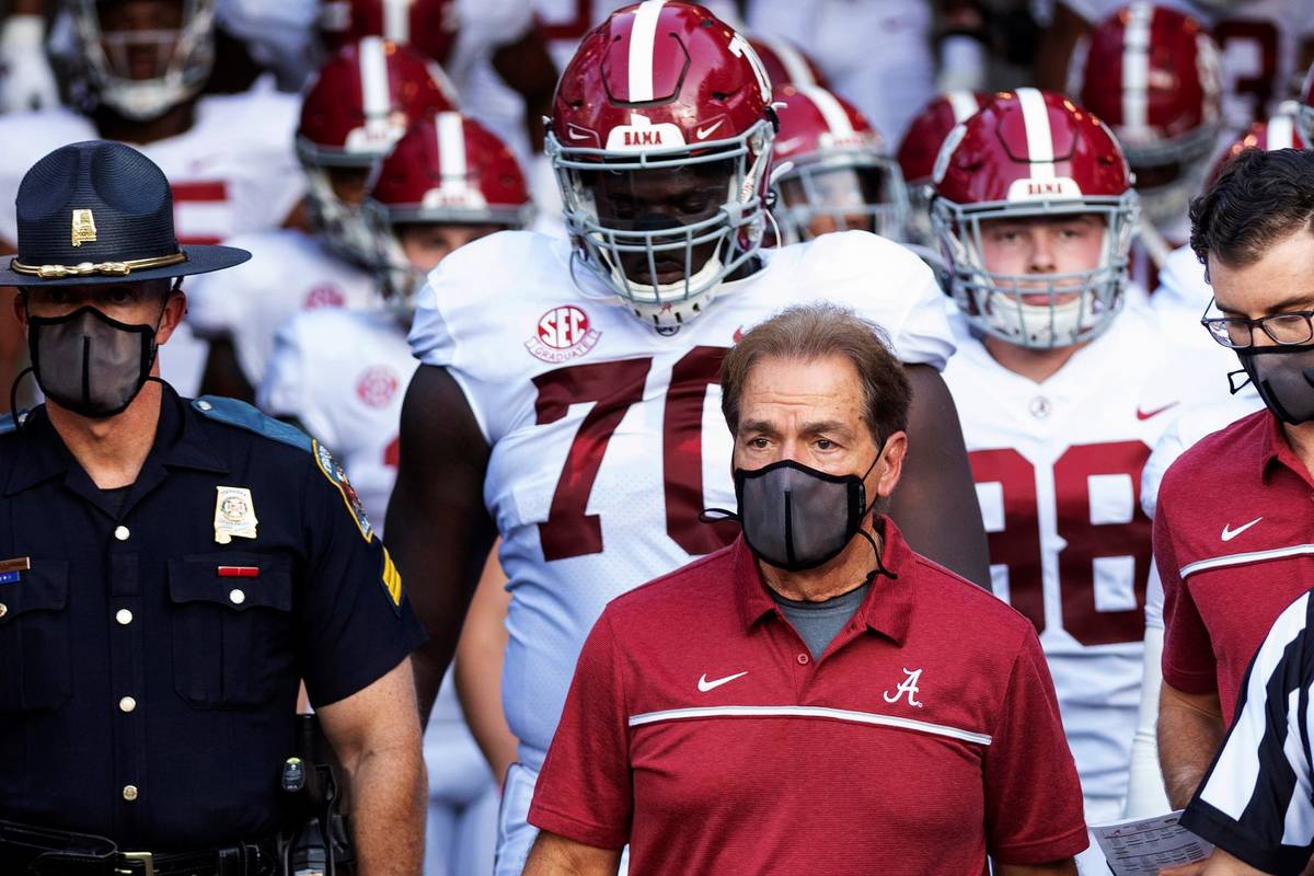 FILE - In this Sept. 26, 2020, file photo, Alabama coach Nick Saban leads his team to the field ...