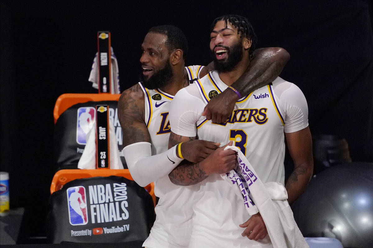 Los Angeles Lakers' LeBron James (23) and Anthony Davis (3) celebrate after the Lakers defeated ...