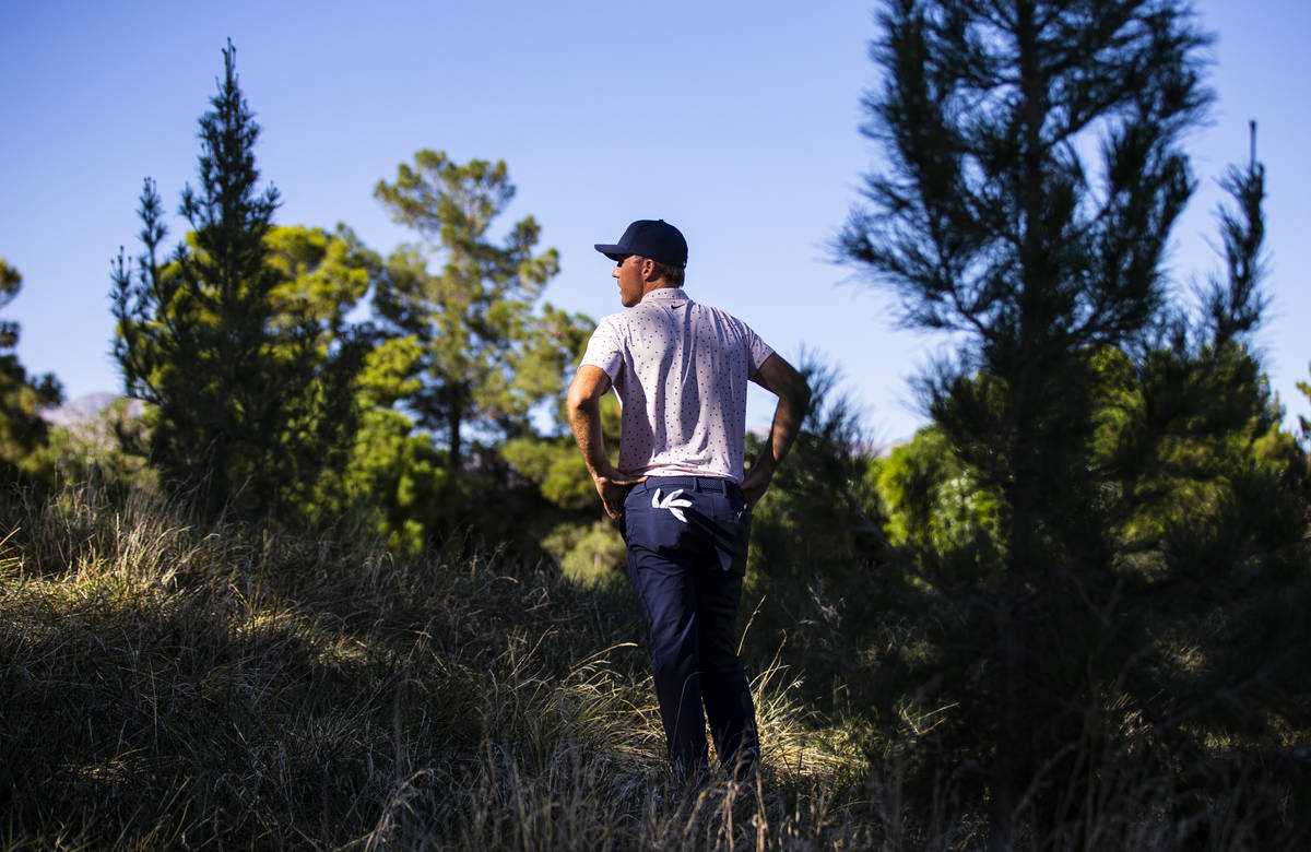 Russell Henley takes in the scene from 13th hole while waiting for the next group to finish dur ...