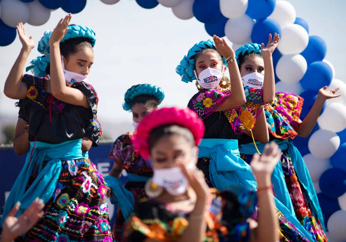 Members of the Mexico Vivo Dance Company perform at a democratic event to promote early voting ...