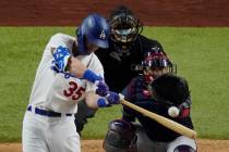 Los Angeles Dodgers' Cody Bellinger hits a home run against the Atlanta Braves during the seven ...