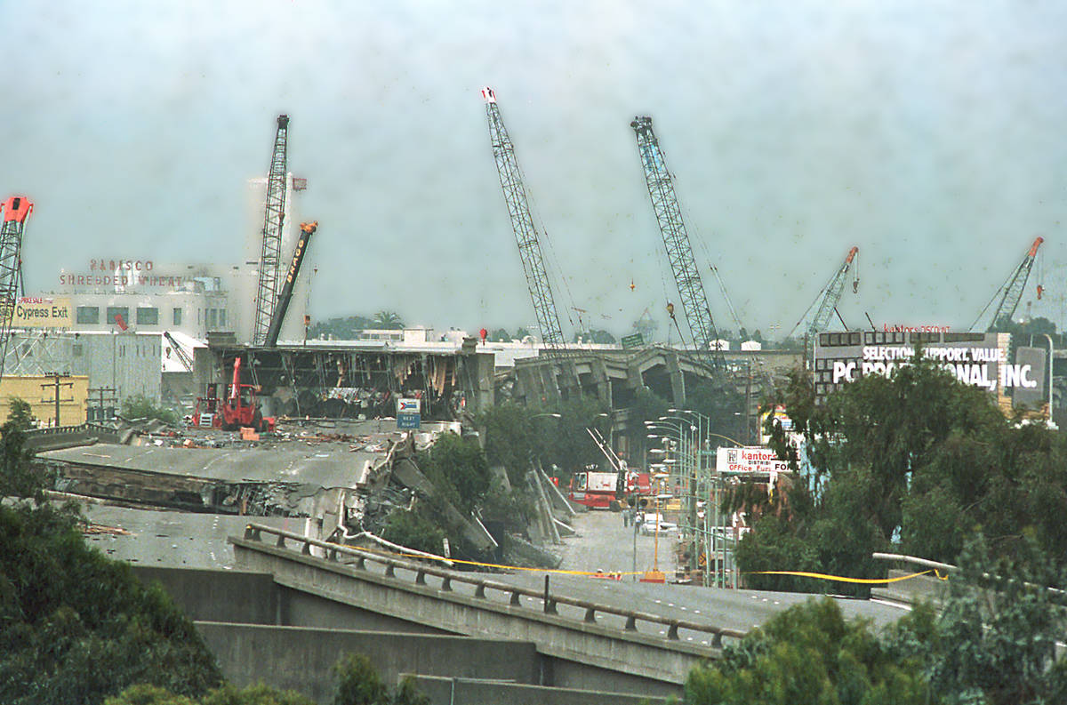 Workcrew continue to cleanup on a damaged section of Interstate 880 in Oakland, Ca. on Sunday, ...