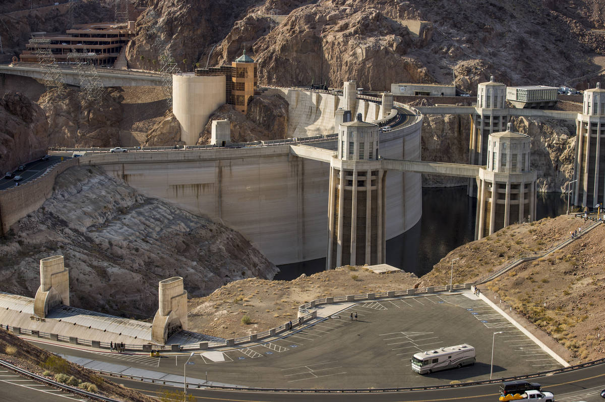 A lone RV is parked with visitors looking at the sights as Hoover Dam opens up to the public af ...