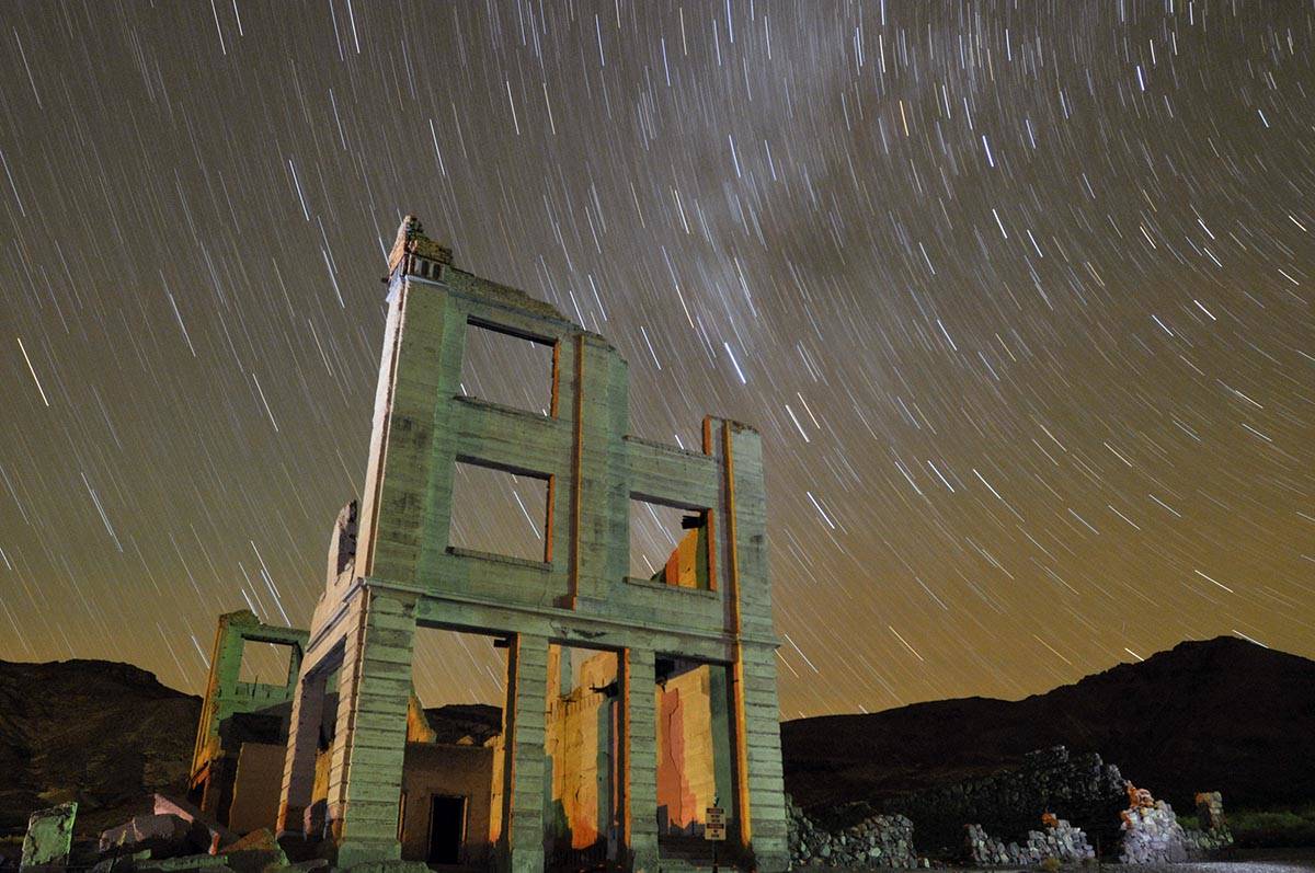 Ruins of the Cook Bank building in Rhyolite, Nev., is shown in this time exposure beneath a cel ...