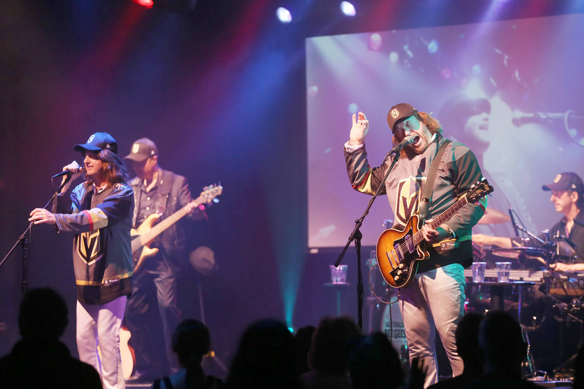 David Scott as Robin Gibb of the Australian Bee Gees, a Bee Gee tribute band, left, and Michael ...