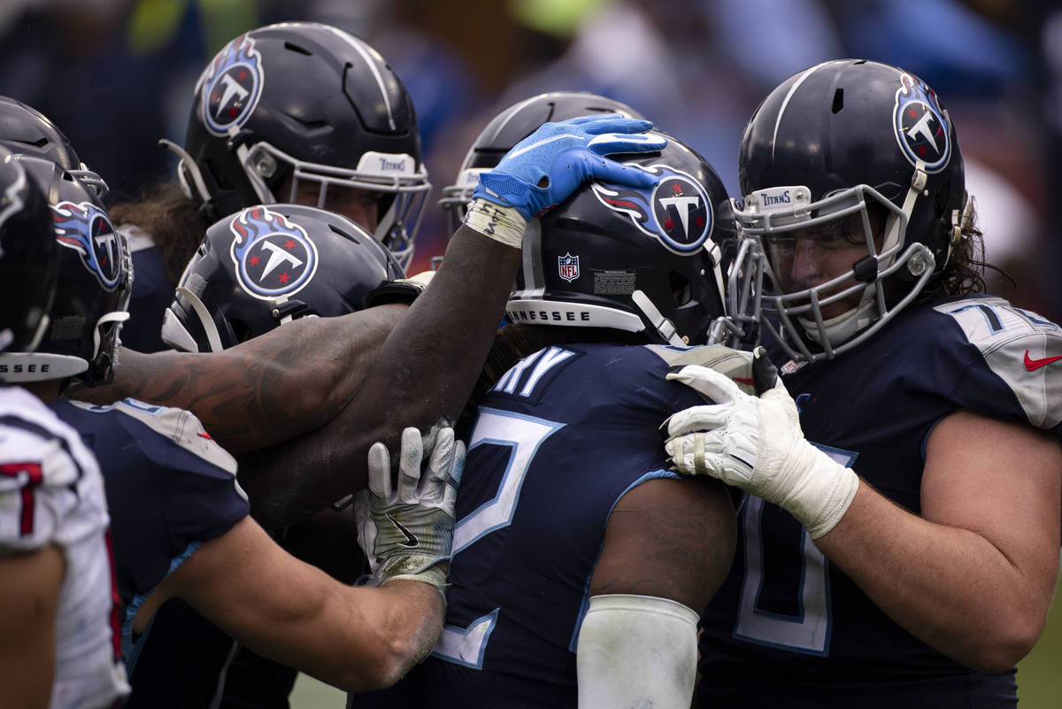Tennessee Titans offensive tackle Ty Sambrailo (70) congratulates running  back Derrick Henry (2 …