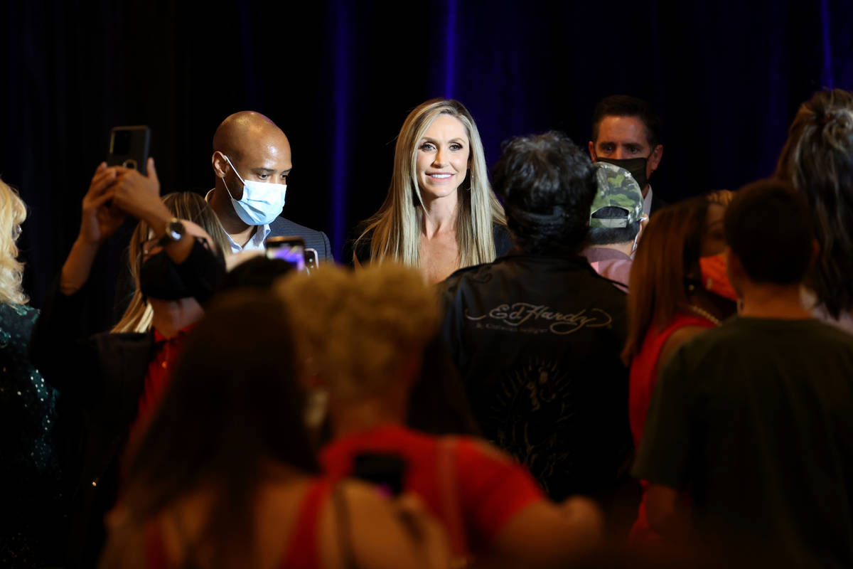 Lara Trump, daughter-in-law of President Donald Trump and wife of Eric Trump, poses with fans a ...