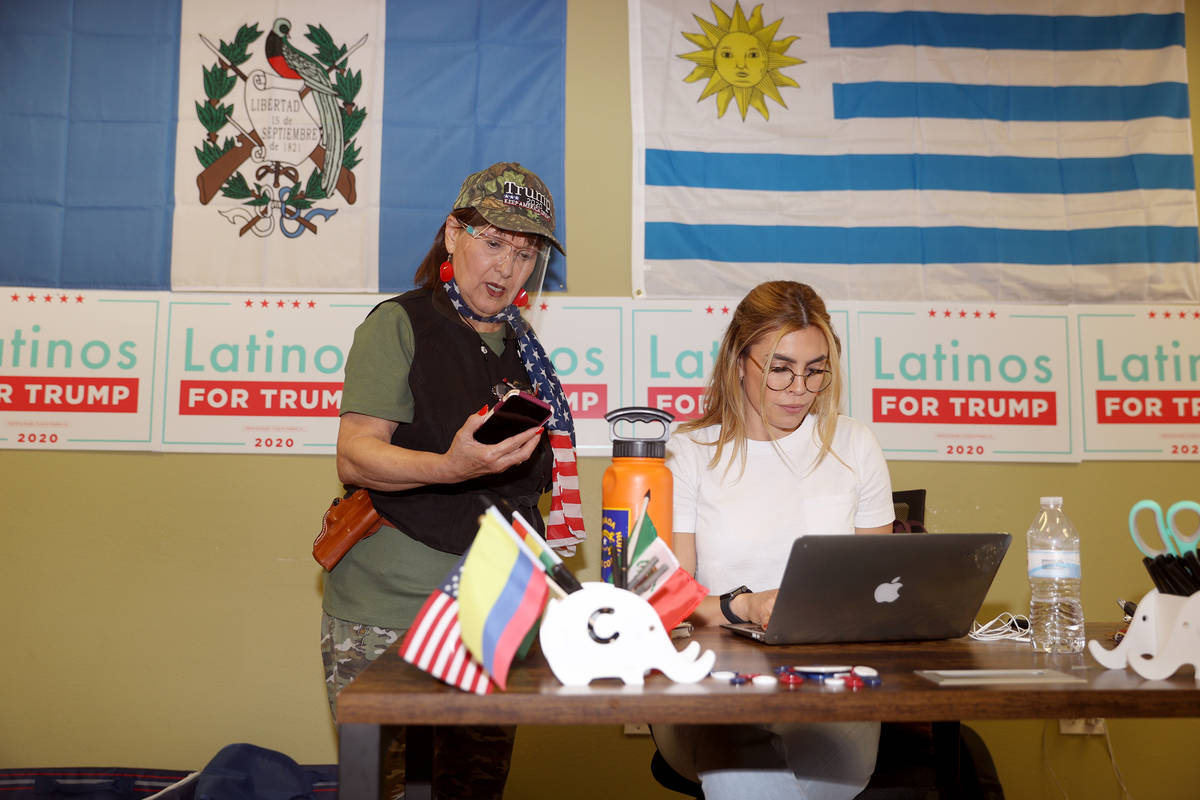 Carolina Serrano, right, Hispanic engagement coordinator for the Nevada Republican Party, assis ...