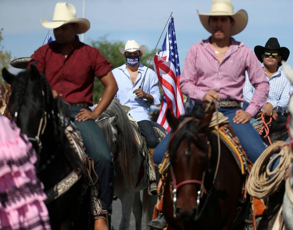 Horseback riders participate during a campaign parade for Assemblyman Edgar Flores and the Bide ...