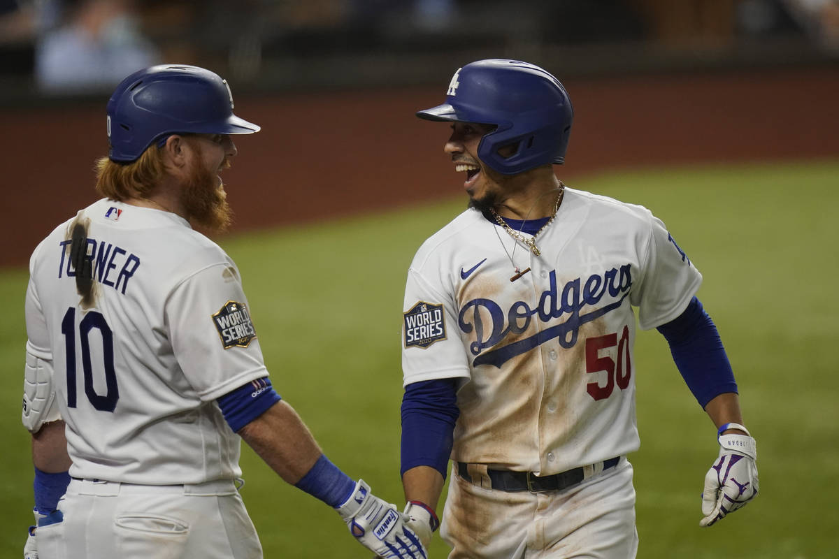 Los Angeles Dodgers' Mookie Betts celebrates a home run against the Tampa Bay Rays during the s ...