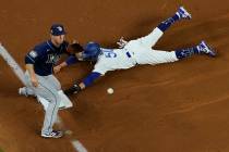 Los Angeles Dodgers right fielder Mookie Betts steals third past Tampa Bay Rays third baseman J ...